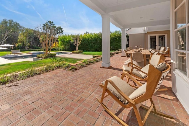 view of patio with an outdoor pool and french doors