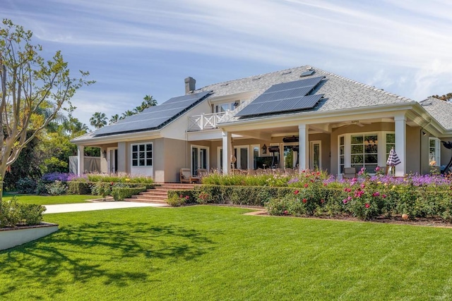 16625 Via Lago Azul, Rancho Santa Fe, CA 92067 - back of house with a ceiling fan, solar panels, a yard, and stucco siding
