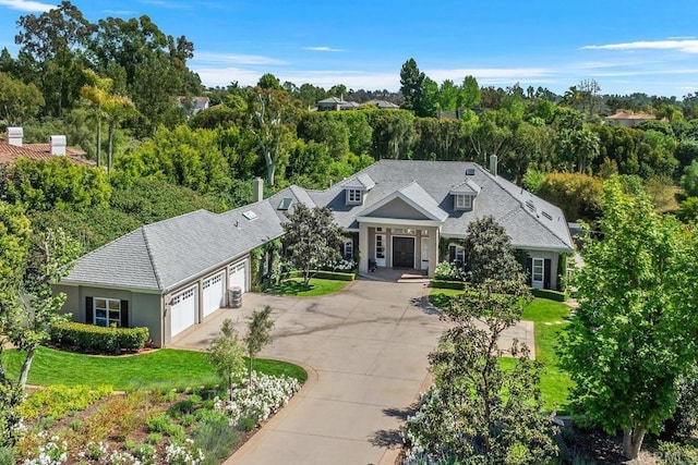 16625 Via Lago Azul, Rancho Santa Fe, CA 92067 - view of front of house with an attached garage, concrete driveway, a front lawn, and a shingled roof
