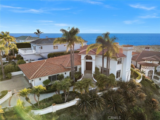 birds eye view of property with a water view