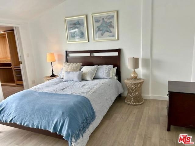 bedroom with light hardwood / wood-style floors