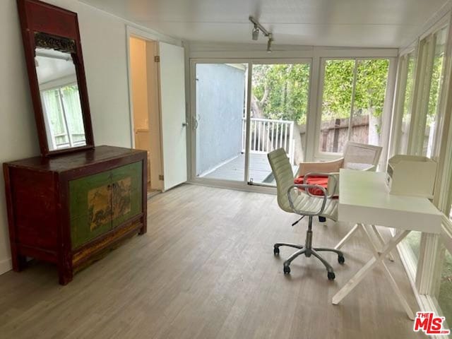 office area with a healthy amount of sunlight and light wood-type flooring