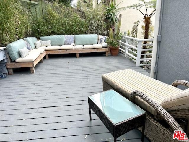 wooden deck featuring outdoor lounge area