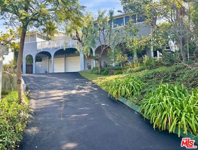 view of front of property with a garage