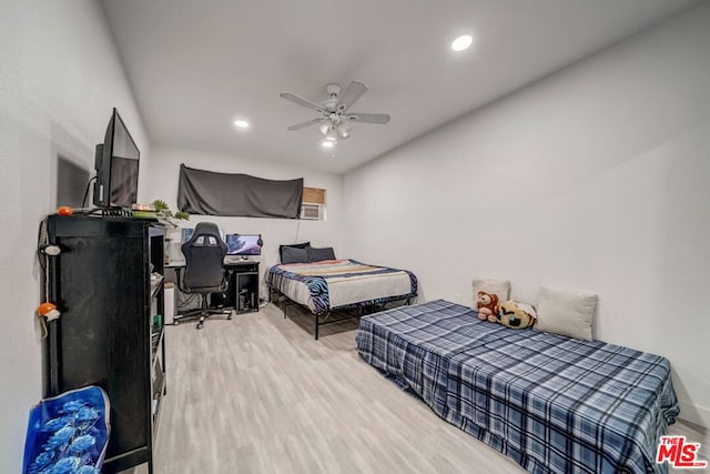 bedroom with hardwood / wood-style flooring and ceiling fan