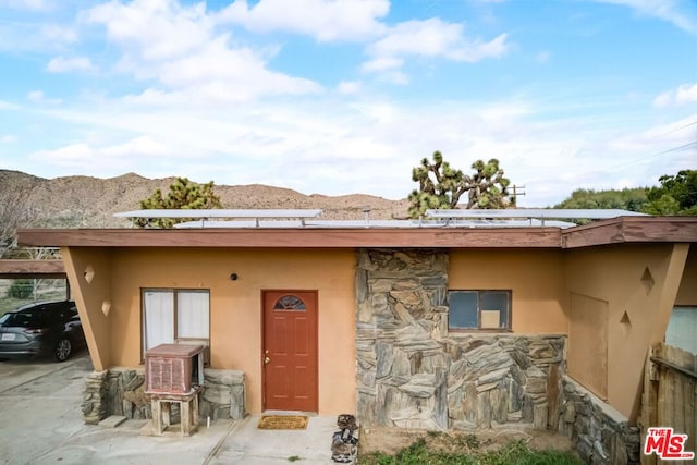 view of front facade with a mountain view