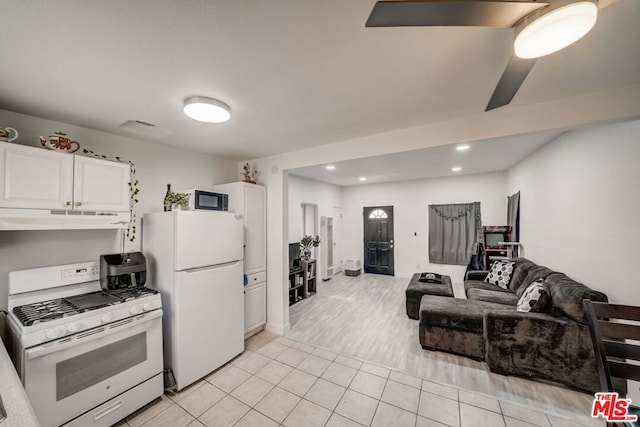 kitchen featuring white cabinetry, white appliances, and light tile patterned floors