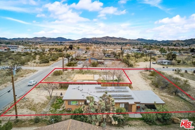 drone / aerial view featuring a mountain view