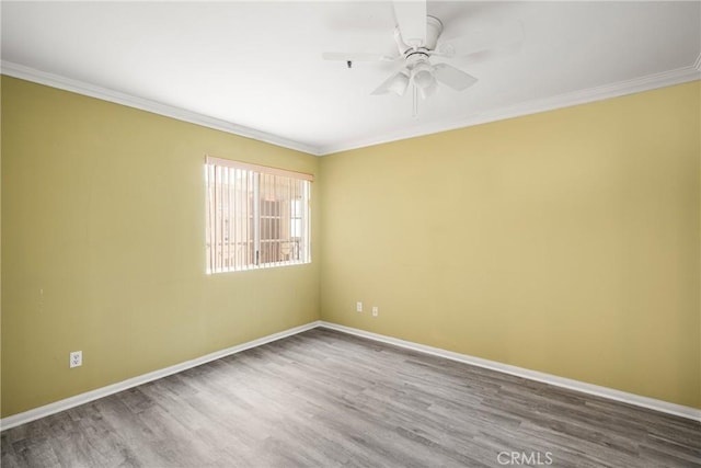 spare room featuring crown molding, ceiling fan, and hardwood / wood-style floors