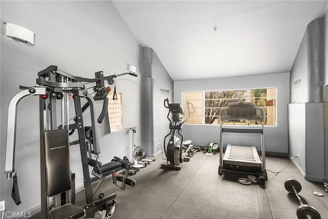 workout room featuring vaulted ceiling