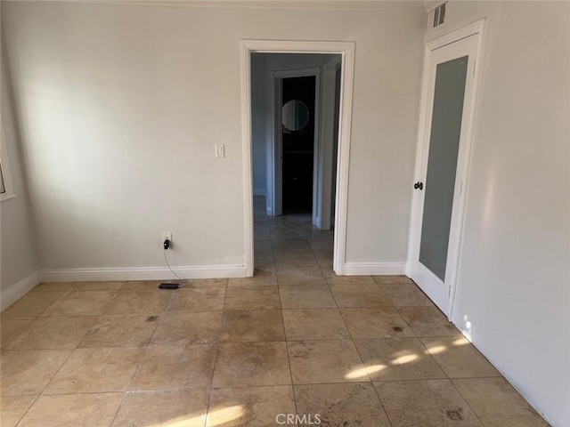 view of tiled spare room