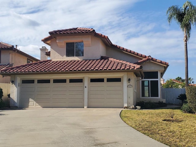 mediterranean / spanish-style house featuring a front yard