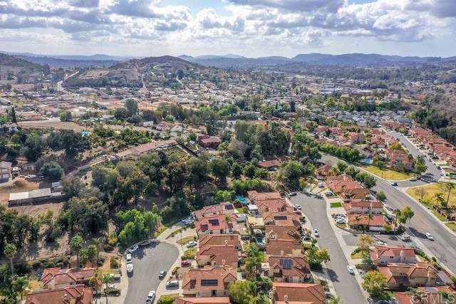 birds eye view of property featuring a mountain view