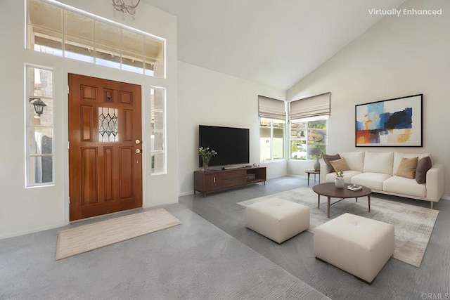 living room featuring light colored carpet and high vaulted ceiling