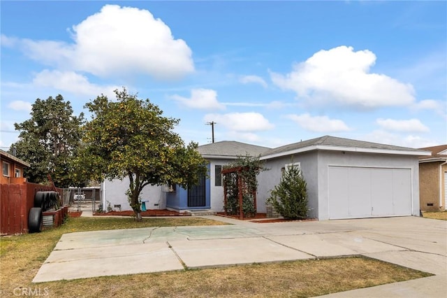 view of front of house featuring a garage and a front lawn