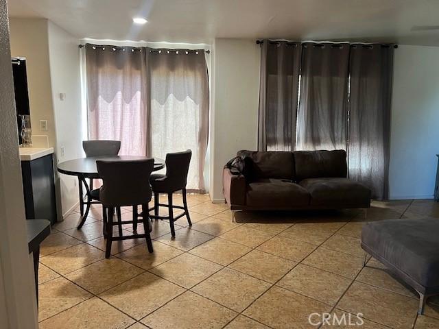 dining space featuring light tile patterned floors