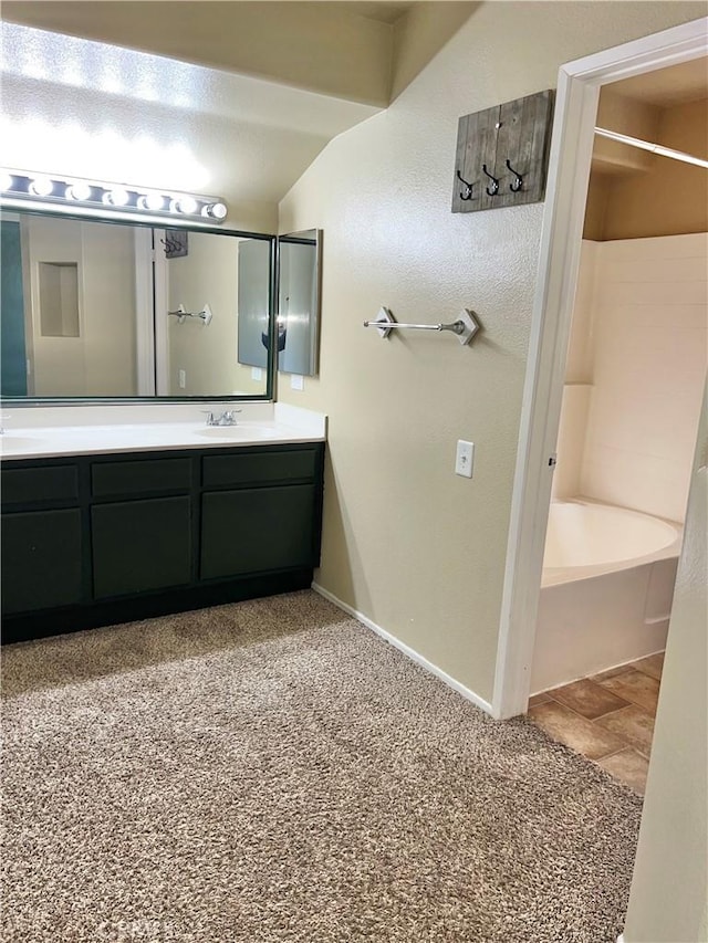 bathroom with vanity and shower / washtub combination