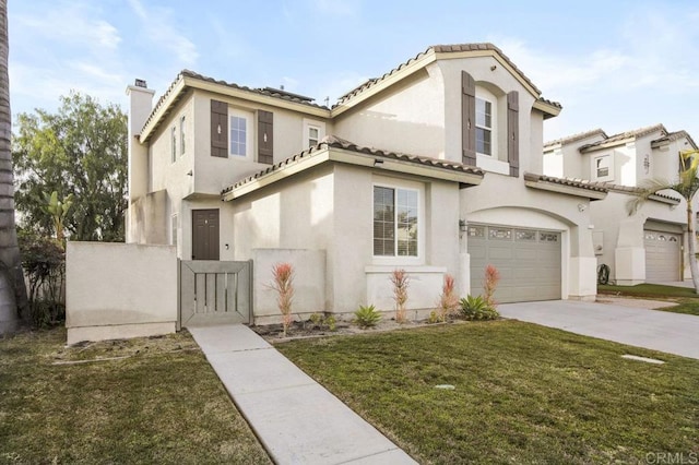 mediterranean / spanish house featuring a garage and a front yard