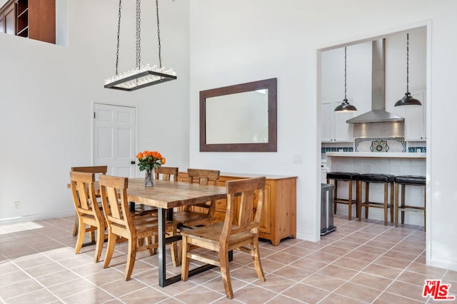 dining area featuring light tile patterned floors