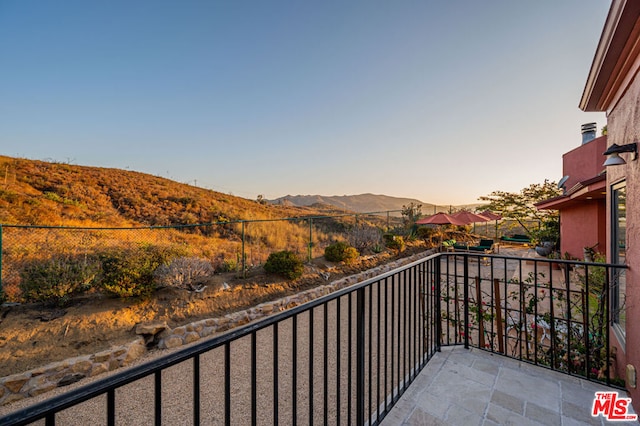 balcony at dusk with a mountain view