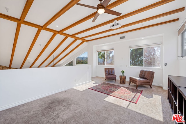 living area with light carpet, lofted ceiling with beams, and ceiling fan