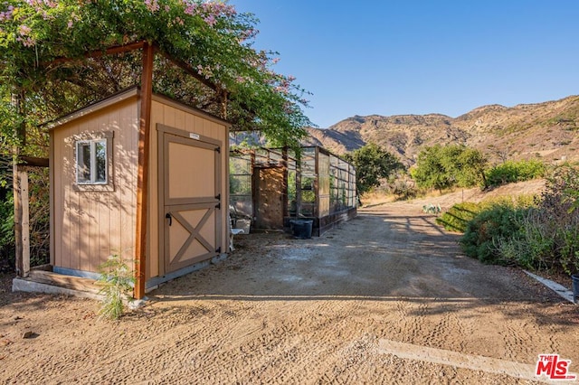 exterior space featuring a mountain view