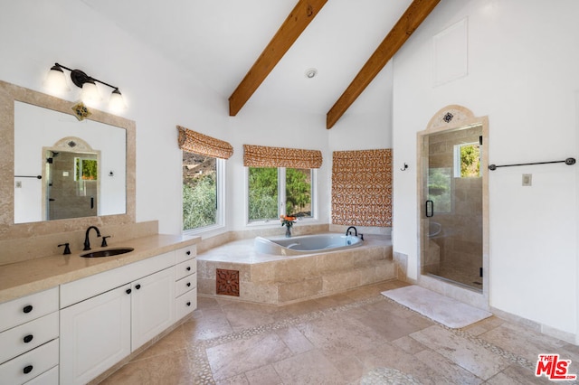 bathroom featuring vanity, separate shower and tub, and beam ceiling