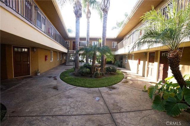 view of property's community featuring a patio area