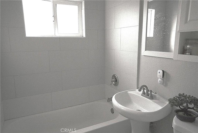 full bathroom featuring  shower combination, toilet, and sink