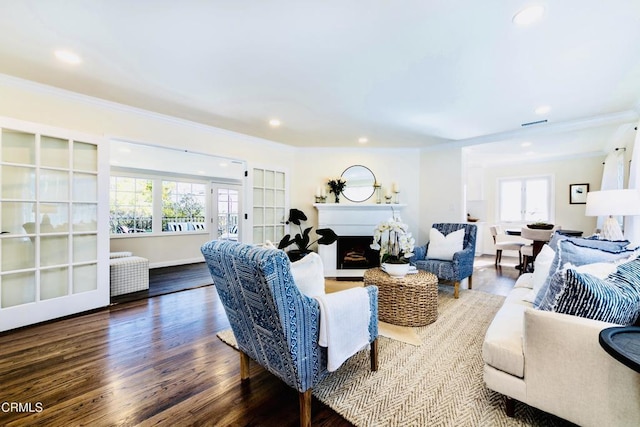 living room with ornamental molding and wood-type flooring