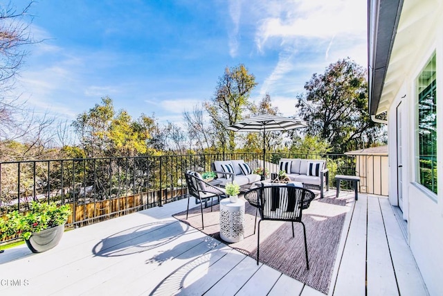 wooden deck featuring an outdoor hangout area