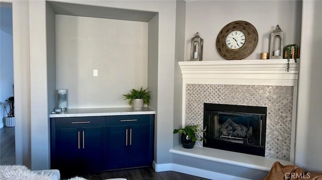 interior space with a fireplace and dark hardwood / wood-style floors