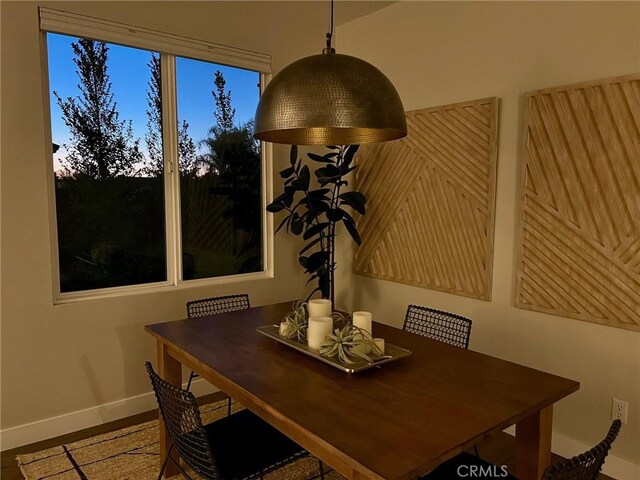 dining area featuring wood-type flooring