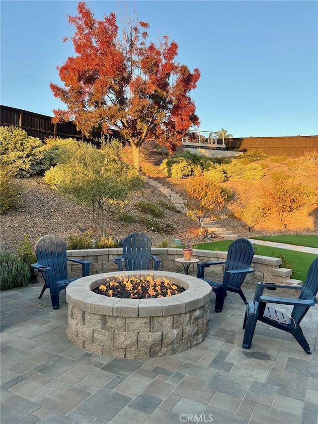 view of patio featuring a fire pit