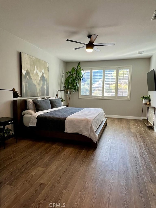 bedroom featuring hardwood / wood-style flooring and ceiling fan