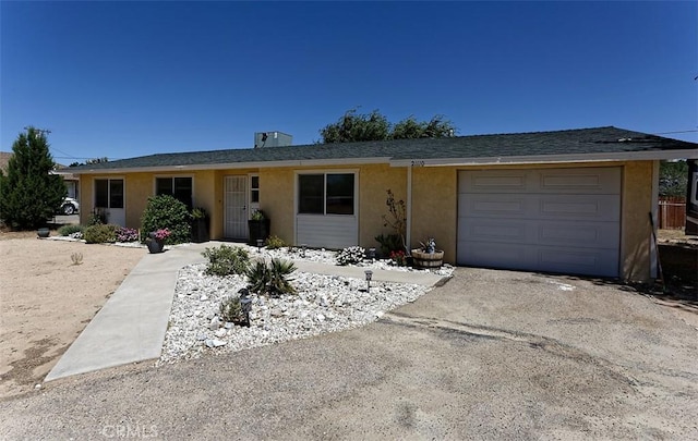 single story home featuring a garage