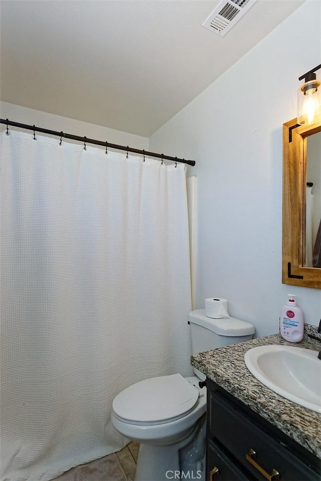 full bathroom with tile patterned flooring, visible vents, vanity, and toilet