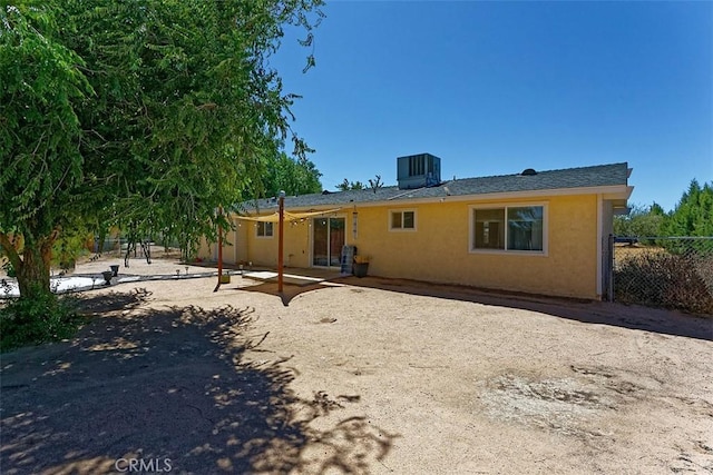 rear view of house featuring central AC and a patio area