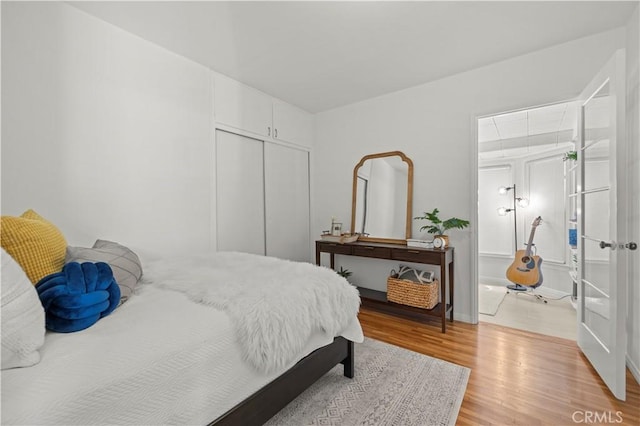 bedroom with a closet and light wood-type flooring