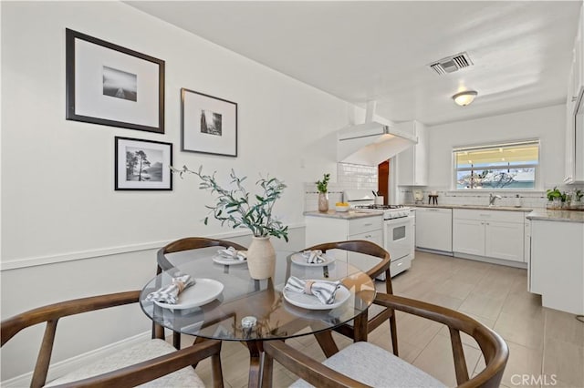 dining space featuring sink