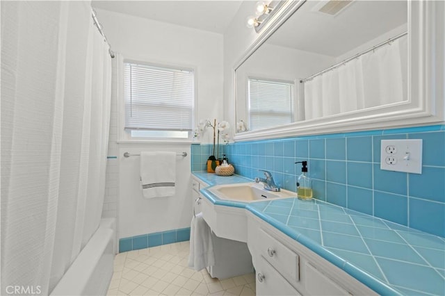 bathroom with vanity, tile patterned flooring, and shower / bath combo with shower curtain