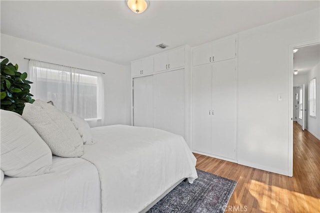 bedroom featuring wood-type flooring