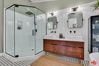 bathroom with vanity and walk in shower