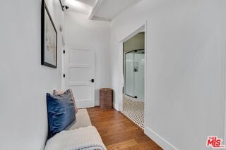 corridor featuring hardwood / wood-style flooring