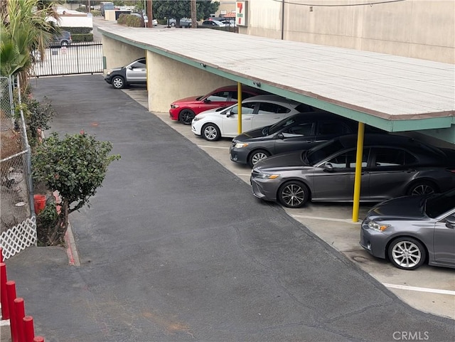 view of vehicle parking with a carport