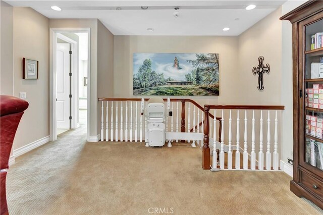 hallway with light carpet