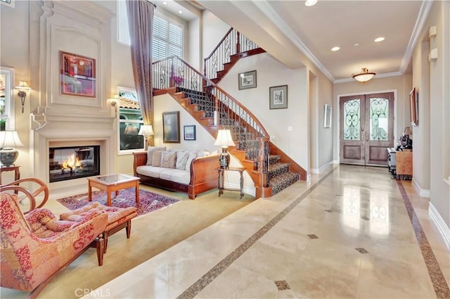 entryway featuring french doors and ornamental molding