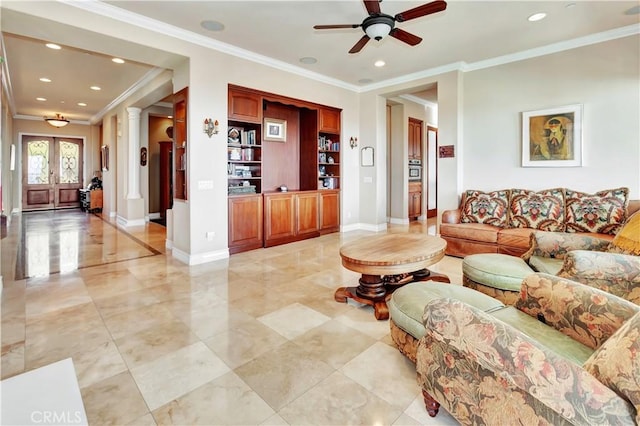 living room with ceiling fan, ornamental molding, and ornate columns