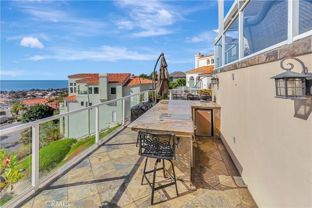 view of patio / terrace featuring a water view