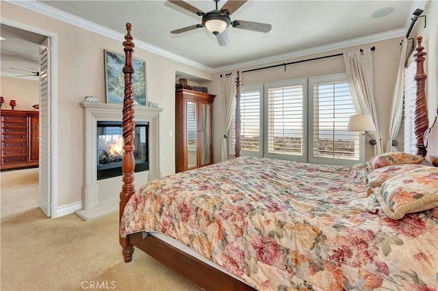 bedroom with light carpet, crown molding, ceiling fan, and a multi sided fireplace